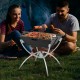 Camping grill with stainless steel grills, set up for BBQ, featuring aluminum legs and a carrying bag for easy.