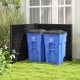 Outdoor privacy fence screen in black with two blue recycling bins, ideal for concealing yard equipment and trash.
