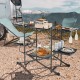 Folding portable outdoor cook station with heat-resistant aluminum tabletop, featuring multiple side tables and storage.