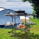 Folding portable outdoor cook station with heat-resistant aluminum tabletop and four side tables for cooking and prep.