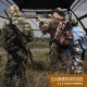 360° one-way see-through hunting blind with camouflage patterns, ideal for 2-3 people, set up in a natural environment.