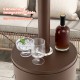 Round table design of the 50000 BTU propane patio heater in brown, featuring easy access for drinks and snacks.