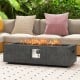 42.5-inch fire pit table with stainless steel burner, featuring a textured magnesium oxide design for outdoor warmth.