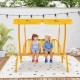 Kids enjoying the yellow 2-seater patio swing with adjustable canopy, designed for safety and fun in outdoor spaces.
