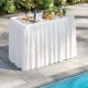 Portable 4-foot ice cooler folding table with large sink, white skirt, perfect for outdoor parties and events.