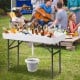 Folding 4 feet plastic party ice table with matching skirt, featuring a drain system, ideal for outdoor gatherings.