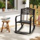 Patio rocking chair with floral backrest, made of sturdy cast aluminum, perfect for backyard relaxation.