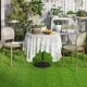 Interlocking artificial grass tiles in a lush green setting, perfect for indoor and outdoor use with a realistic.