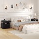 Modern black nightstand with charging station, sliding top storage, and three open compartments for organized bedroom.