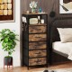 Modern nightstand with 5 fabric drawers, charging station, and wood-like surface for stylish bedroom storage.