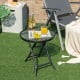 Compact patio side table with tempered glass tabletop, sturdy steel frame, perfect for poolside or backyard use.