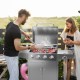 Stainless steel 5-burner propane gas grill with side burner and prep tables, ideal for outdoor cooking and grilling.
