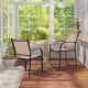 Set of 2 stackable patio dining chairs with armrests in brown, perfect for garden or backyard relaxation.