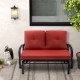 Brick red cushioned 2-person glider bench with ergonomic armrests, perfect for patio or garden relaxation.