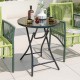 Round bistro table with tempered glass tabletop and sturdy metal frame, perfect for outdoor or indoor use.