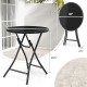 23-inch round bistro table with tempered glass tabletop, featuring a sturdy metal frame, ideal for backyard or poolside.