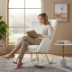 Nursery rocking chair with curved backrest and armrests in white, featuring teddy fleece cover and ergonomic support.