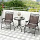 Close-up of the breathable fabric on a folding patio chair, designed for comfort and durability in outdoor settings.