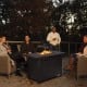 Rectangular propane fire pit table with lava rocks, 60,000 BTU, and waterproof cover, perfect for outdoor gatherings.