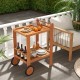 2 Tier Rolling Serving Cart with teak oil finish, featuring wine bottle holders and rubber wheels, perfect for outdoor.