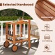 2 Tier rolling serving cart in selected hardwood with slatted design, featuring wine bottle holders and rubber wheels.
