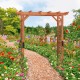 Elegant 7 feet garden wooden high arbor arch with lattice panels, perfect for pathways and supporting climbing plants.