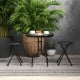 Collapsible black round stools with handles, featuring a sturdy metal frame, ideal for versatile indoor and outdoor use.