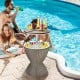 Patio rattan cooler bar table with retractable tabletop, 8-gallon capacity, ideal for poolside parties and snacks.