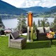 Stainless steel patio heater with glass tube, providing 40,000 BTU warmth for outdoor gatherings and relaxation.