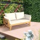 Adjustable patio convertible sofa in solid acacia wood with thick white cushions, perfect for outdoor relaxation.