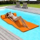 Orange 3-layer floating water mat with head support, ideal for poolside relaxation and water activities.