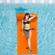 Bright orange 3-layer tear-proof water mat floating in a pool, providing buoyancy and head support for relaxation.