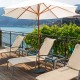 Patio resin umbrella base stand weighing 49 lbs, designed for stability with freestanding umbrellas or under tables.