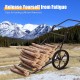 Folding deer game cart with large 17" wheels and heavy-duty steel frame, ideal for hauling firewood outdoors.