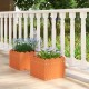 Square orange planter boxes with drainage gaps, perfect for flowers or vegetables on a front porch or balcony.