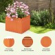 Square orange planter box with charming fence design and drainage gaps, perfect for flowers and vegetables in gardens.