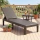 Brown outdoor chaise lounger chair positioned on a deck, featuring a waterproof rattan textured surface for outdoor.