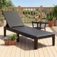Black outdoor chaise lounger with waterproof rattan textured surface, adjustable backrest, and 330 lbs capacity for.