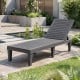 Grey outdoor chaise lounge chair with adjustable backrest, perfect for patio or poolside relaxation.