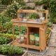 Outdoor garden wooden work station potting bench with a large metal tabletop, big drawer, and removable lower shelf.