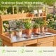 Outdoor garden wooden work station potting bench with a large metal tabletop and solid wood construction for gardening tasks.