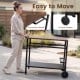 Outdoor grill cart with a stainless top, spice rack, and hooks, designed for easy movement and organization in the patio.