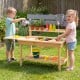 Outdoor kids mud kitchen featuring a spacious tabletop, water tank, and natural fir wood for imaginative play and.