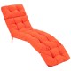 Side view of a thick orange outdoor lounge chaise cushion with string ties, designed for comfort and durability in.