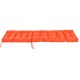 Thick orange outdoor lounge chaise cushion with string ties, made from waterproof polyester for garden and poolside use.