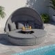 Round outdoor daybed with retractable canopy and gray cushions, perfect for poolside relaxation and comfort.