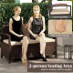 Outdoor PE wicker storage bench for 2 with soft cushion, curved armrests, and under-seat storage, perfect for relaxing.