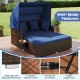 Outdoor patio rattan daybed with retractable canopy and side tables, featuring navy cushions and a durable metal frame.