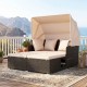 Outdoor patio rattan daybed with beige cushions and retractable canopy, perfect for backyard relaxation by the poolside.