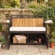 Outdoor storage bench with acacia wood backrest, PE rattan, and side tables, ideal for garden relaxation and tool.